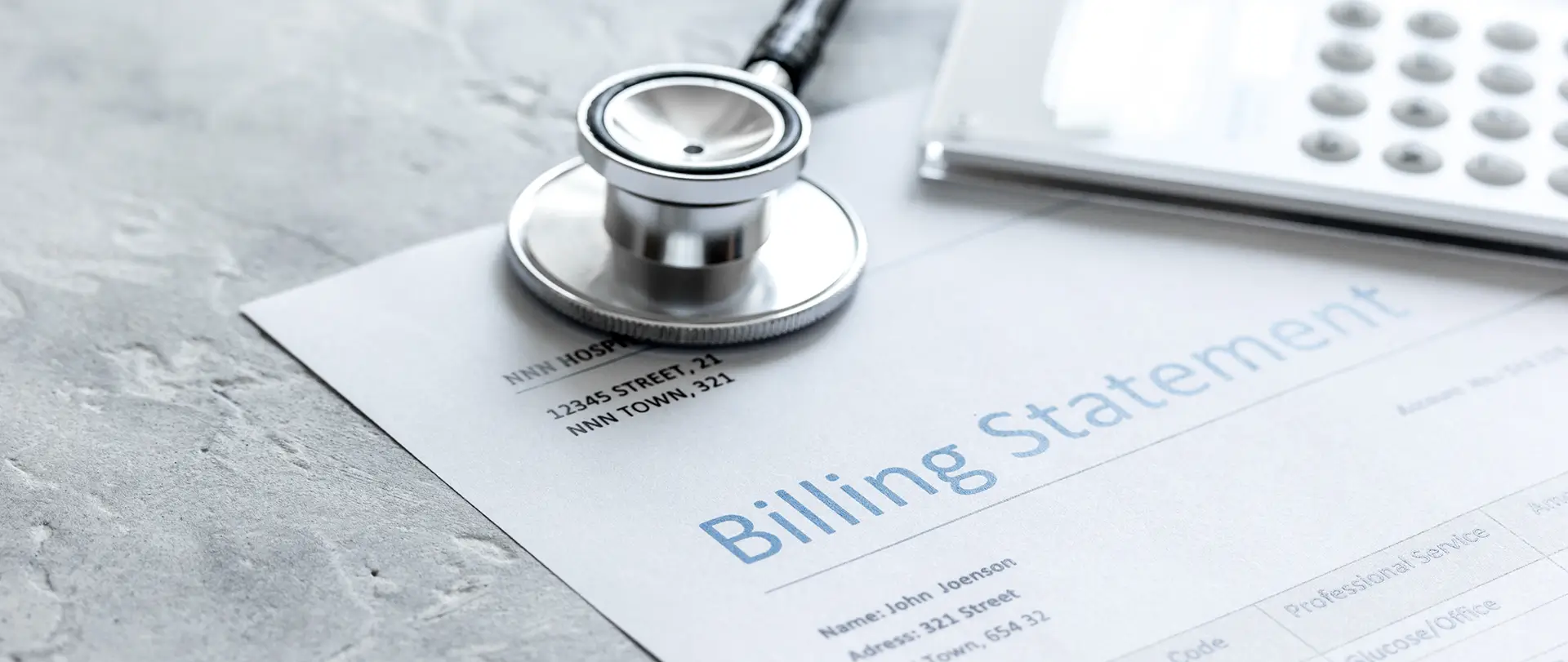 Billing statement with a stethoscope placed on top, symbolizing healthcare expenses and medical billing.