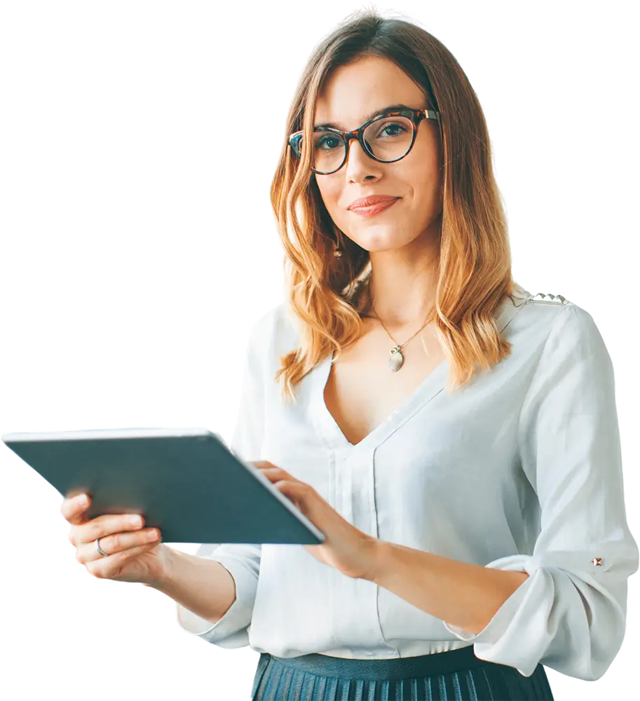 A woman wearing glasses is holding a tablet computer, focused on the screen with a thoughtful expression.