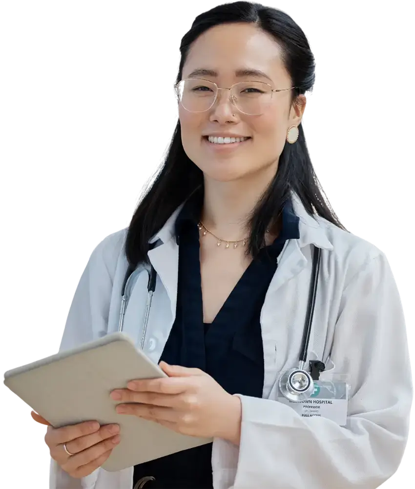 a woman wearing glasses and a white lab coat holding a tablet