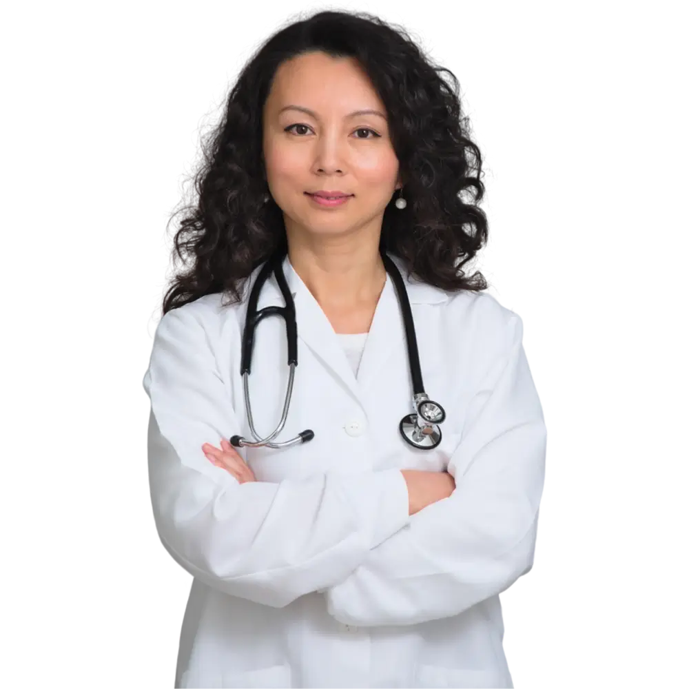 A female doctor stands confidently with her arms crossed, wearing a white coat and a stethoscope around her neck.